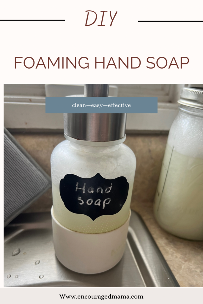 hand soap dispenser sitting on sink edge